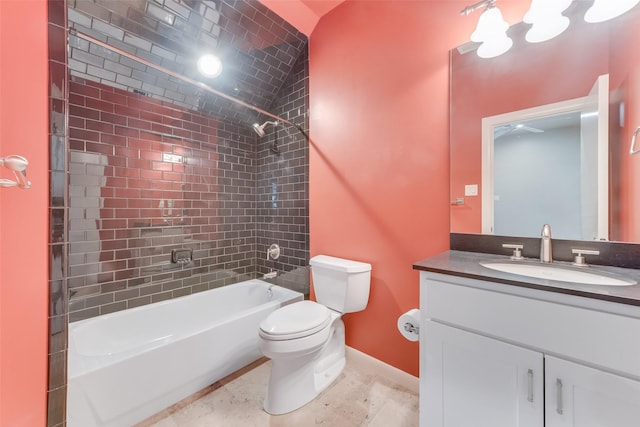 full bathroom with tiled shower / bath, vanity, and toilet