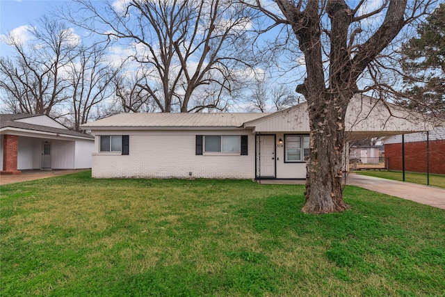 ranch-style house with a front lawn and a carport