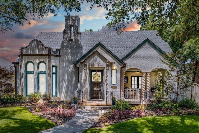 view of front of house with a yard