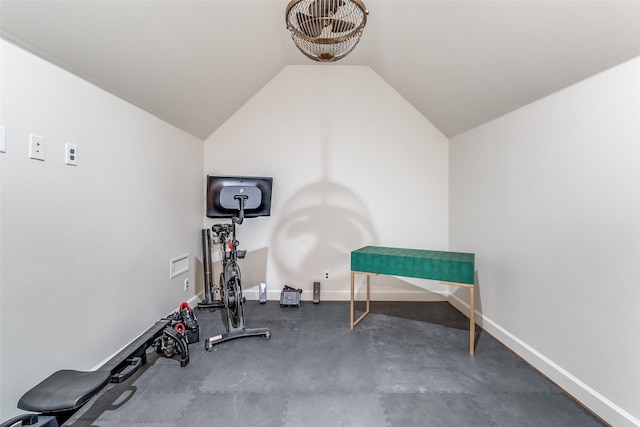 workout room with vaulted ceiling