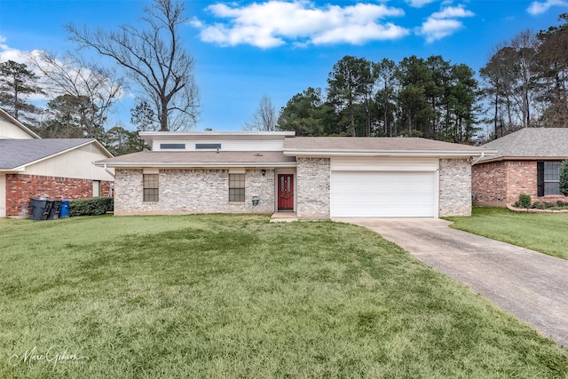 view of front of property featuring a garage and a front yard