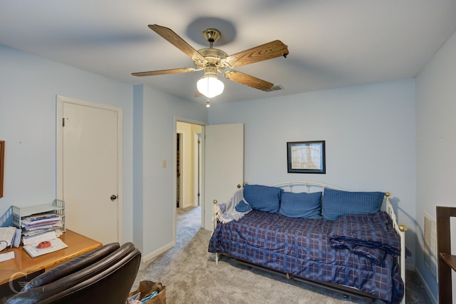 bedroom featuring light colored carpet and ceiling fan