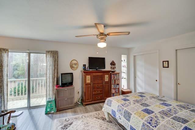 bedroom with multiple closets, ceiling fan, light hardwood / wood-style floors, and access to outside