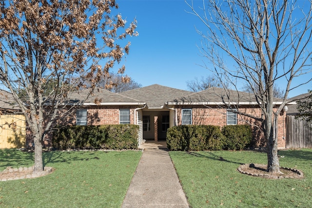 ranch-style home with a front yard