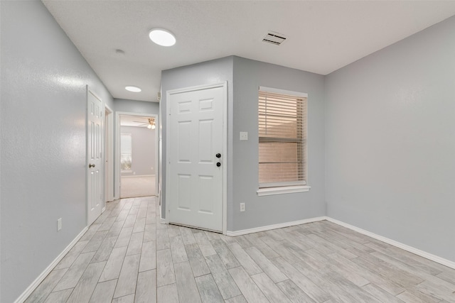 spare room with light hardwood / wood-style floors