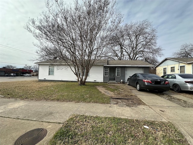 view of front of home with a garage and a front yard