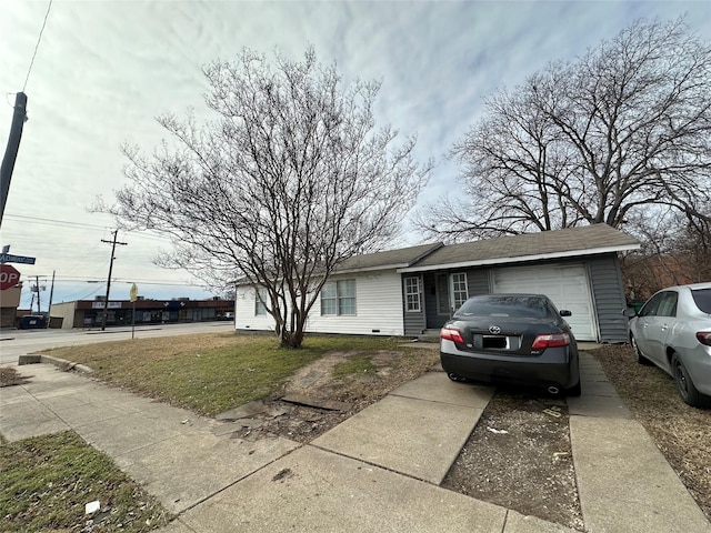 single story home with a garage