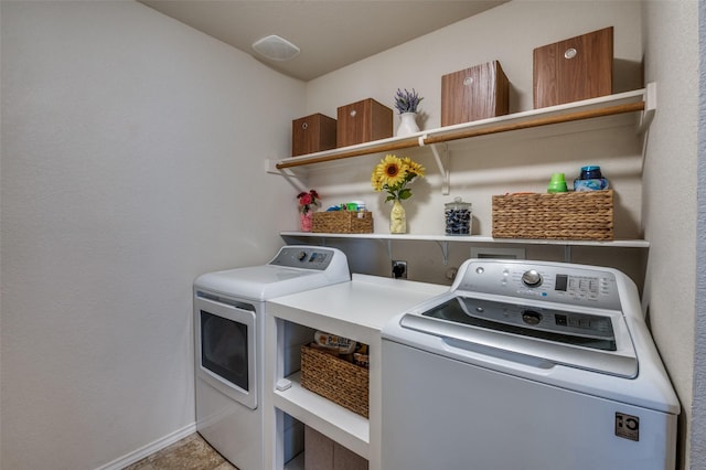 laundry area with washing machine and clothes dryer