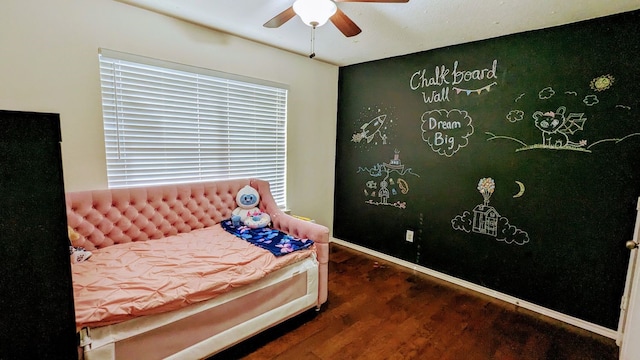 bedroom featuring dark wood-type flooring and ceiling fan