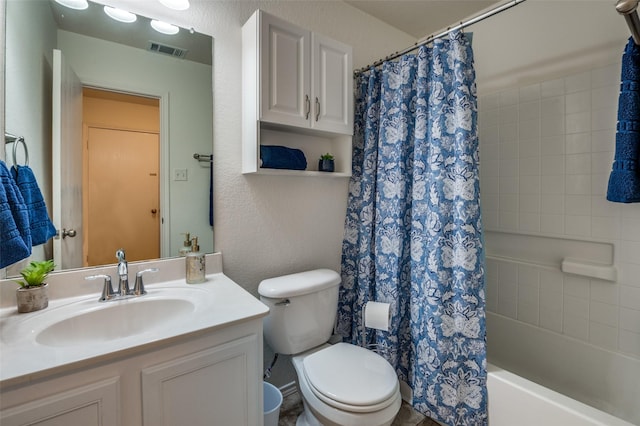 full bathroom with vanity, shower / bath combination with curtain, and toilet