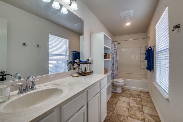 full bathroom with shower / bathtub combination with curtain, vanity, and toilet