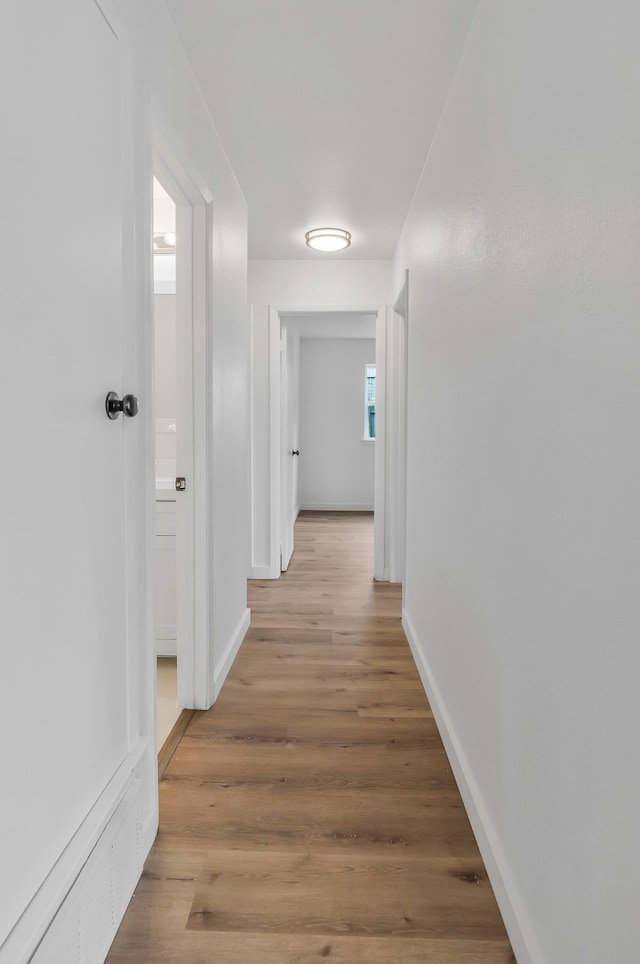 hallway featuring light hardwood / wood-style floors