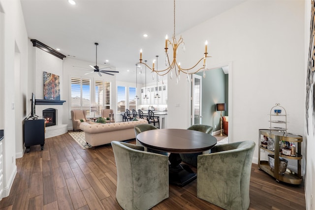 dining area with ceiling fan and dark hardwood / wood-style floors