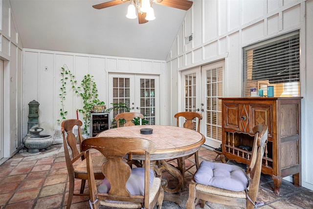 dining space with high vaulted ceiling, wine cooler, ceiling fan, and french doors