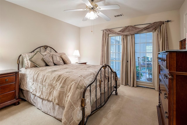 bedroom with access to outside, light carpet, and ceiling fan