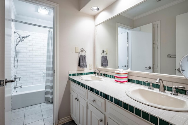 bathroom featuring tile patterned floors, ornamental molding, shower / bath combo with shower curtain, and vanity