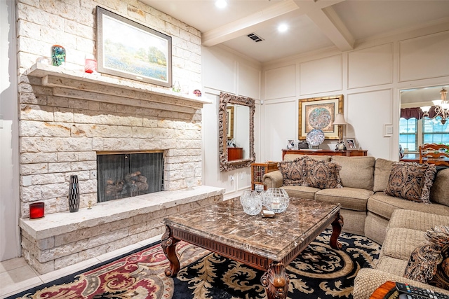 living room featuring an inviting chandelier, a fireplace, coffered ceiling, and beamed ceiling