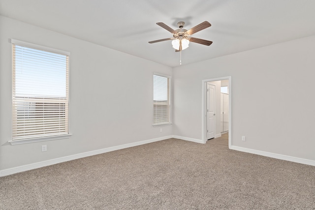 carpeted empty room with ceiling fan