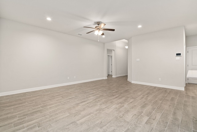 spare room featuring ceiling fan and light hardwood / wood-style flooring