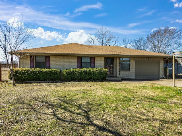 single story home featuring a garage and a front yard