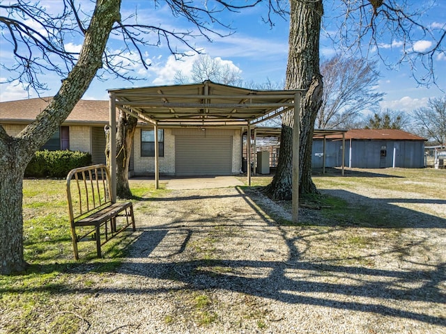 view of front facade featuring a carport and a garage