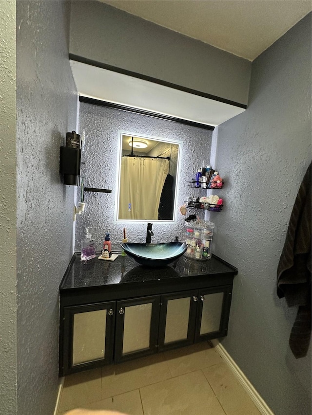 bathroom with vanity and tile patterned flooring