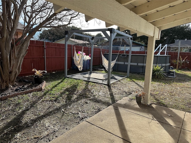 view of patio / terrace with a pergola and a jacuzzi