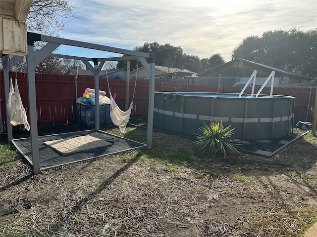 view of yard featuring a fenced in pool