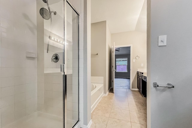 bathroom featuring vanity, tile patterned floors, and plus walk in shower