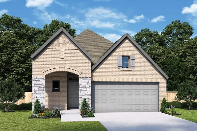 view of front of property featuring a garage and a front lawn