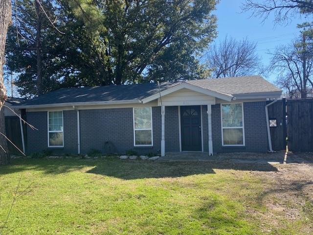 rear view of property with a yard