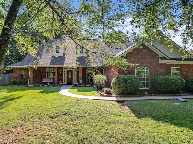 view of front of property with a porch and a front yard