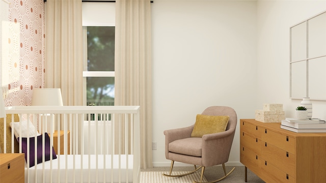 bedroom featuring a nursery area