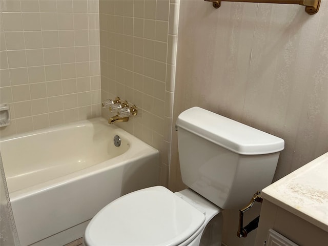 full bath with toilet, bathing tub / shower combination, and vanity