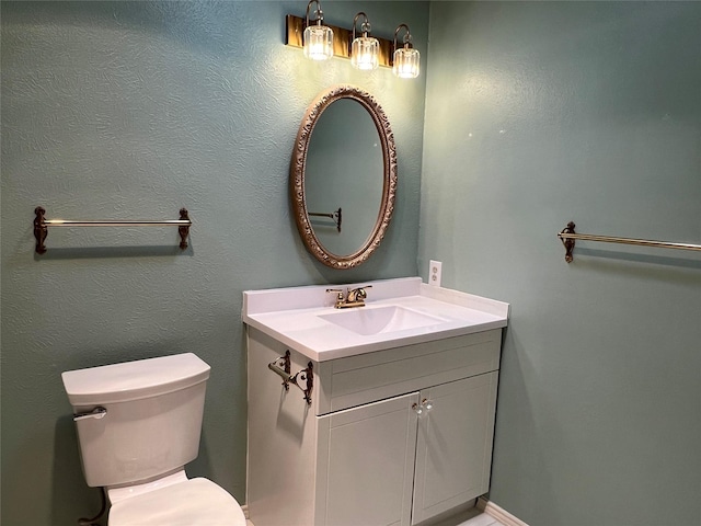 2118 Courtland Cir, Carrollton, TX 75007 - half bathroom featuring vanity and toilet