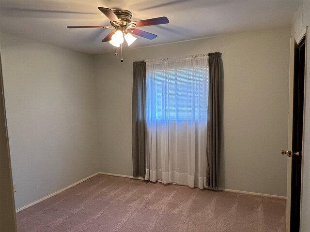 2118 Courtland Cir, Carrollton, TX 75007 - unfurnished room with carpet flooring, a ceiling fan, and baseboards