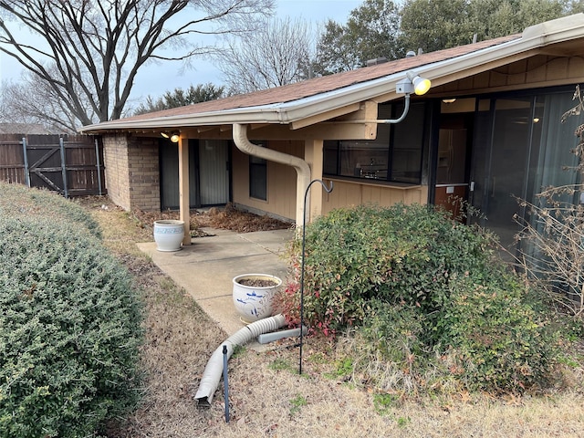 2118 Courtland Cir, Carrollton, TX 75007 - view of side of property with a carport and roof with shingles