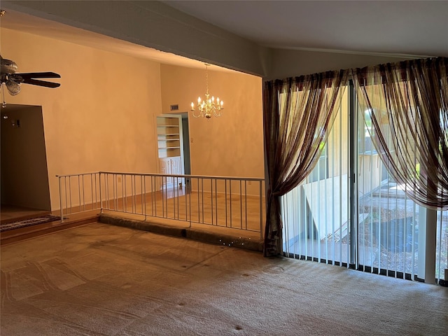 2118 Courtland Cir, Carrollton, TX 75007 - empty room featuring carpet, a chandelier, ceiling fan, and vaulted ceiling