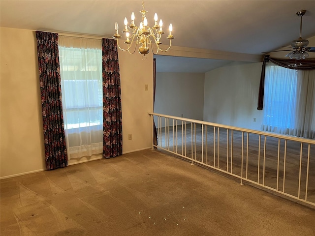 2118 Courtland Cir, Carrollton, TX 75007 - empty room with carpet floors, a chandelier, a ceiling fan, and healthy amount of natural light