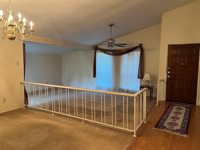 2118 Courtland Cir, Carrollton, TX 75007 - foyer featuring a chandelier, ceiling fan, vaulted ceiling, wood finished floors, and baseboards