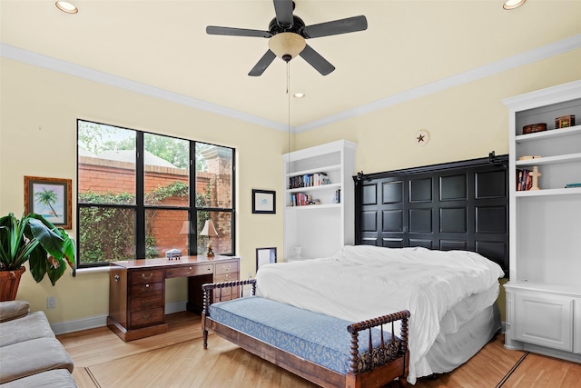 bedroom with crown molding and light hardwood / wood-style floors