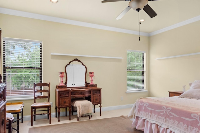 carpeted bedroom with multiple windows, ornamental molding, and ceiling fan