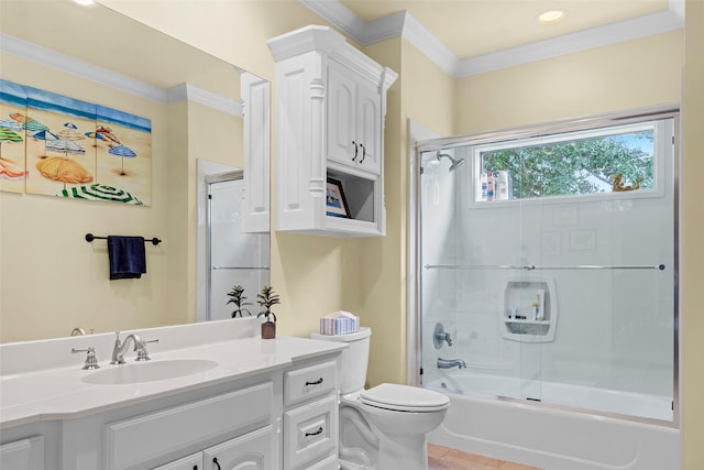 full bathroom with tile patterned floors, toilet, combined bath / shower with glass door, ornamental molding, and vanity