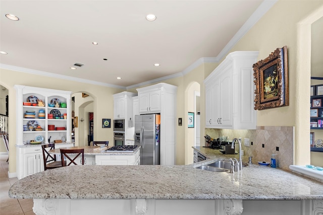 kitchen featuring white cabinetry, sink, backsplash, kitchen peninsula, and stainless steel appliances