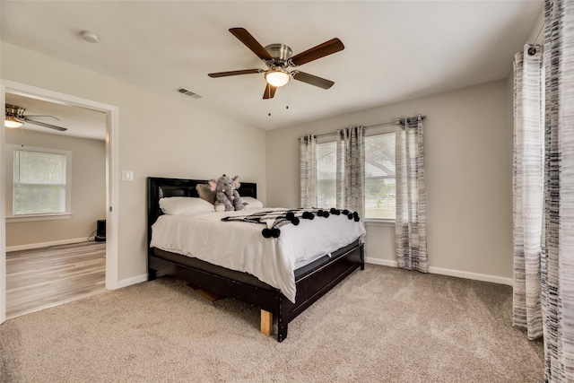 bedroom with ceiling fan and carpet flooring