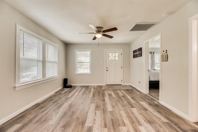 foyer entrance featuring ceiling fan and light hardwood / wood-style floors