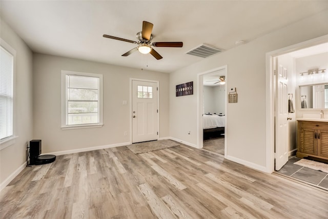 foyer featuring light hardwood / wood-style flooring and ceiling fan