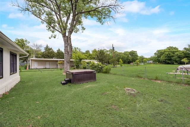 view of yard with a hot tub