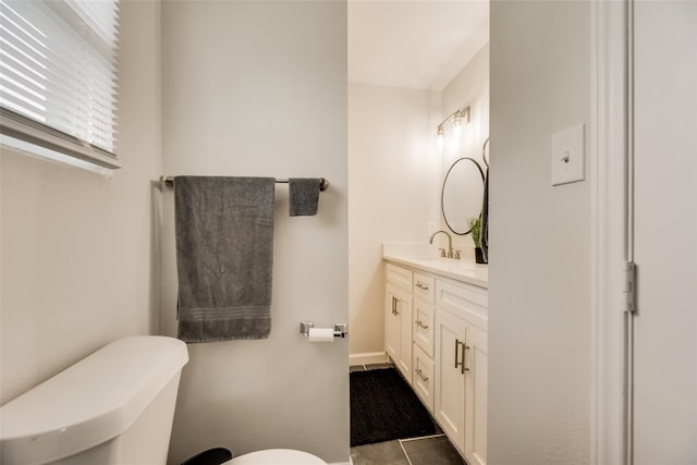 bathroom with vanity and toilet