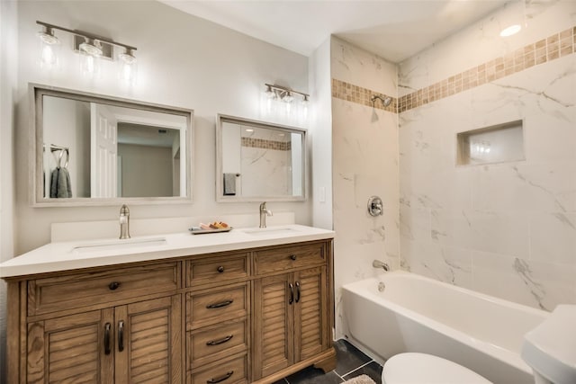 bathroom featuring vanity and tiled shower / bath combo